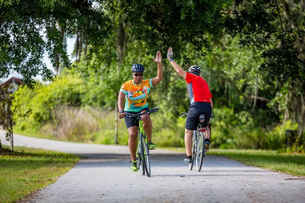 Central Florida tourism photo of cycling. Road bike, hybrid bike on paved trail.